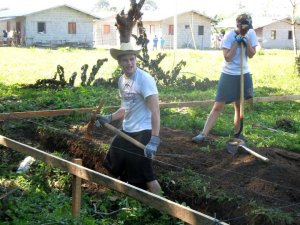 Digging the foundation for a boys home in Villa Soleada.