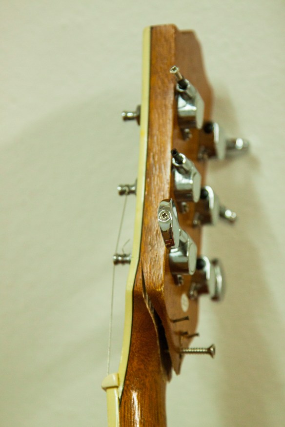 Guitar neck held together with some screws. This guitar isn't playable and needs replaced. 