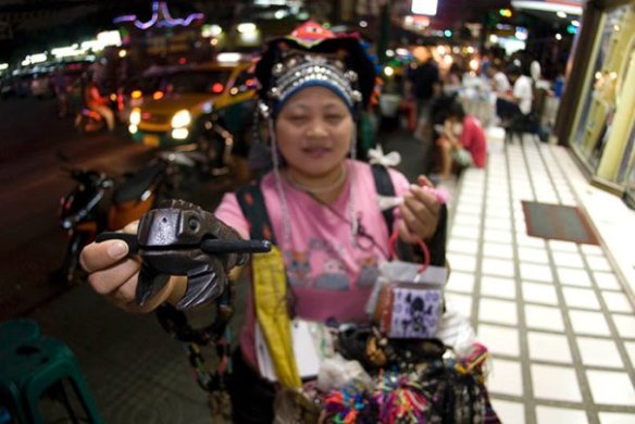 An Akha lady with the famous frog! I love the sound of these toys and will definitely bring one home. 